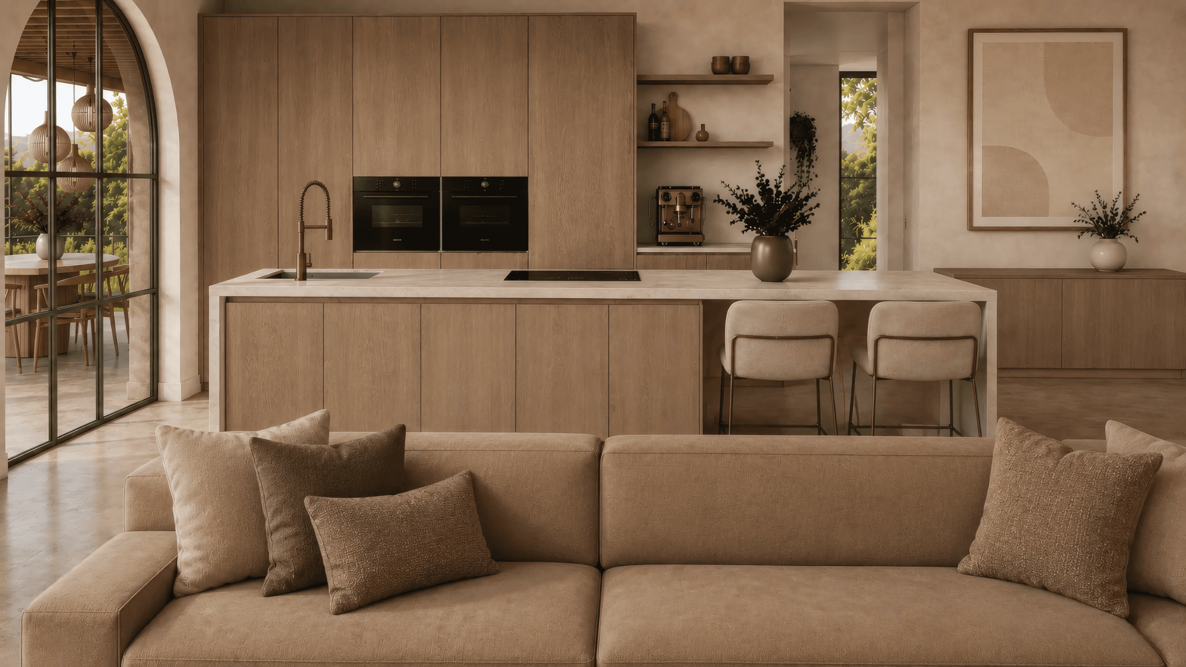 Open-plan kitchen with wood island, light natural stone worktop and warm Mediterranean materials