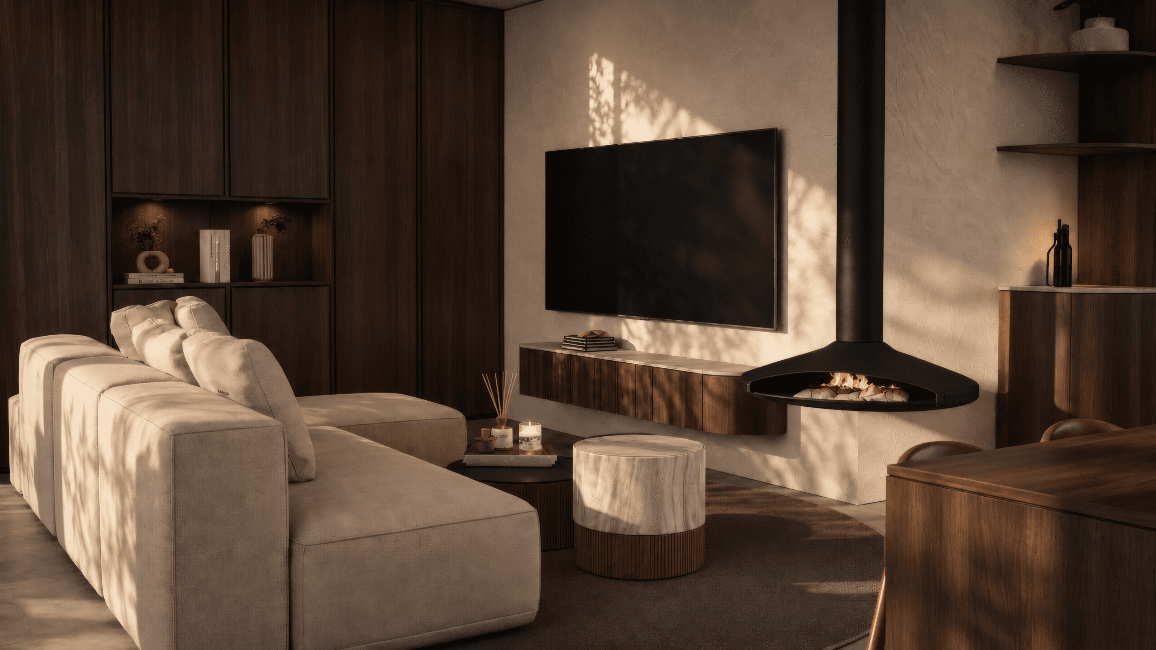 Living room with dark wood panelling, TV wall and a black suspended fireplace in warm evening light
