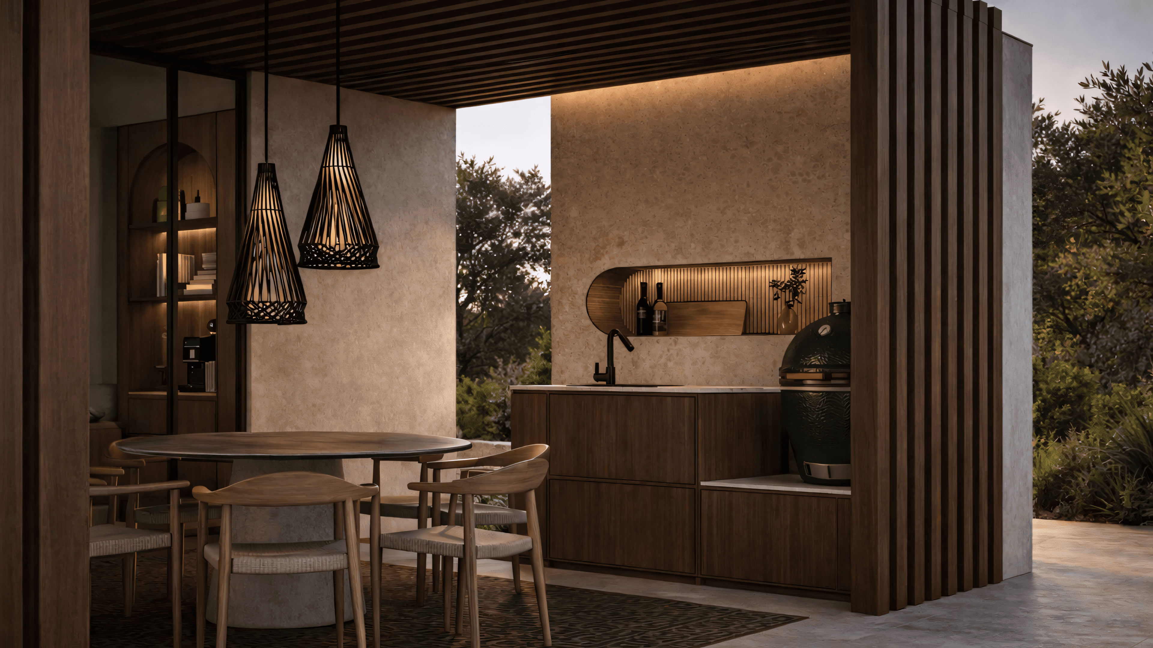 Outdoor kitchen at dusk with walnut cabinets and Big Green Egg ceramic grill