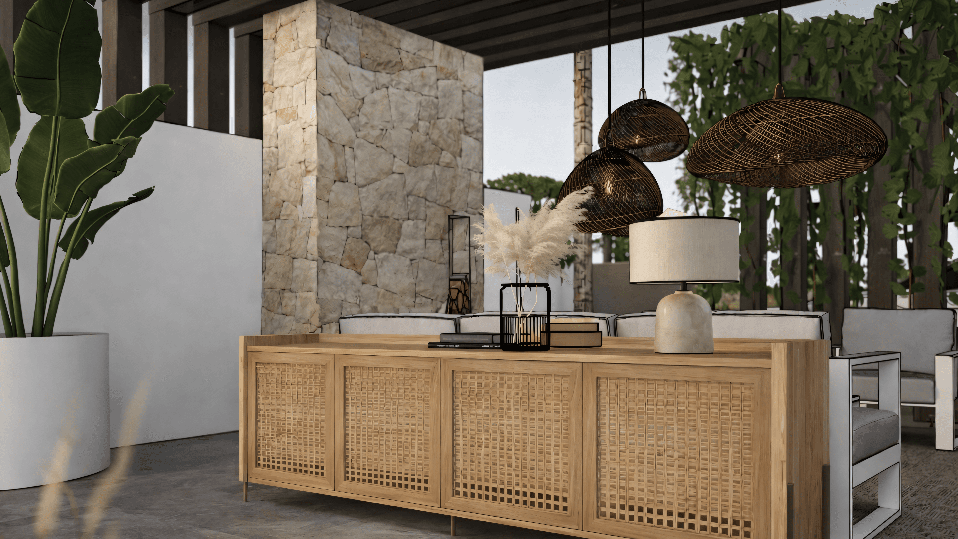 Lounge detail with rattan sideboard, stone wall, rattan pendant lights and pampas grass